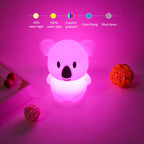 Cute koala-shaped night light emitting a pink glow on a pink background with control options displayed.