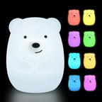 White bear-shaped night light with colorful options on a black background