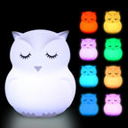 Owl-shaped night light with color-changing options on a black background