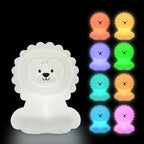 White lion-shaped night light with colorful options on a black background