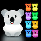 White koala-shaped night light with colorful bear-shaped lights on a black background