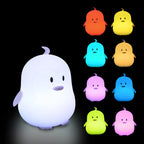 Color-changing ghost-shaped night light with multiple color options on a black background